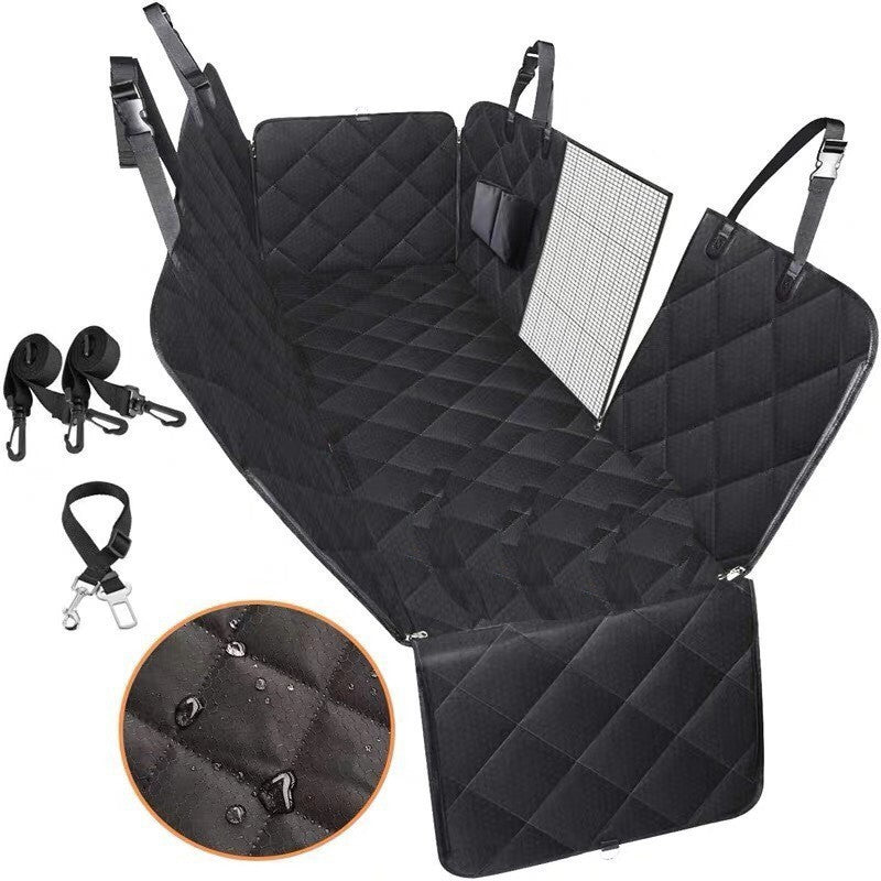 Dog sitting in car seat hammock cover with mesh window