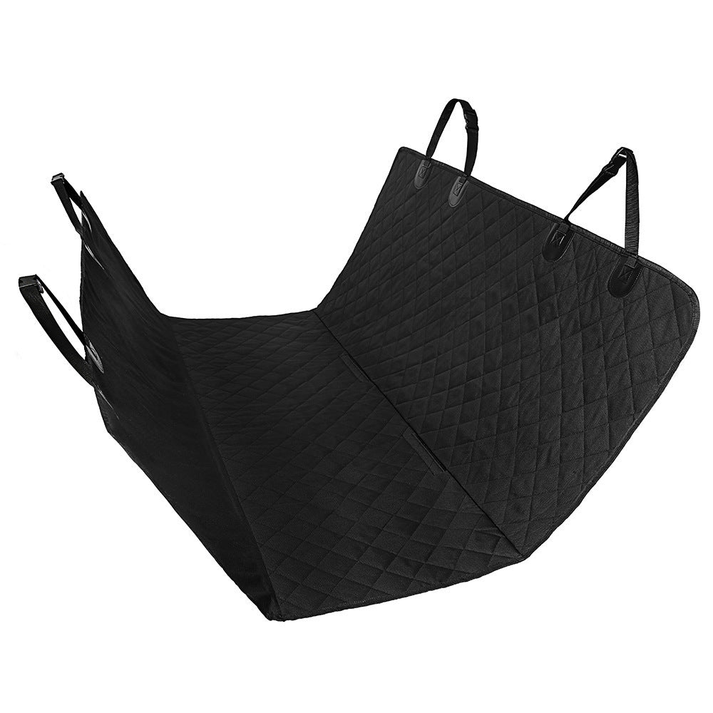Dog sitting in car seat hammock cover with mesh window