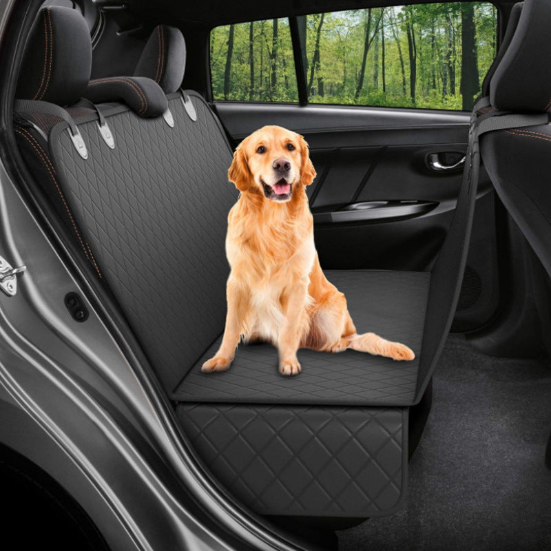 Dog sitting in car seat hammock cover with mesh window