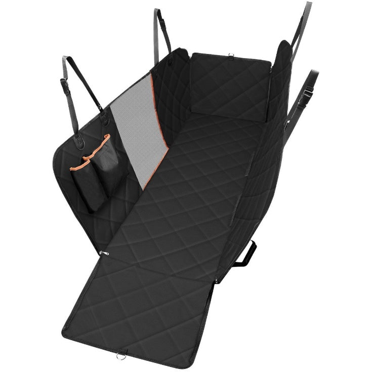 Dog sitting in car seat hammock cover with mesh window