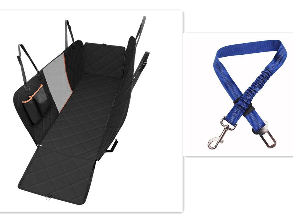 Dog sitting in car seat hammock cover with mesh window