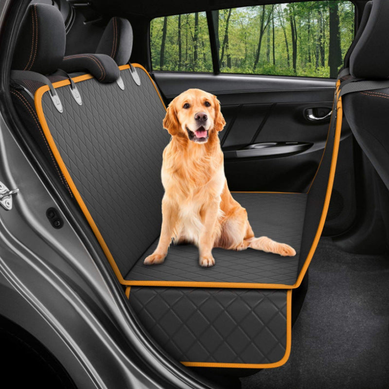 Dog sitting in car seat hammock cover with mesh window